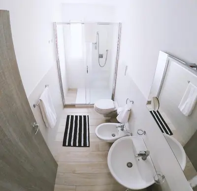a bathroom with a sink and a toilet and a shower at Villa Laurum - Giardino degli allori - Castellammare del Golfo - Scopello in Castellammare del Golfo