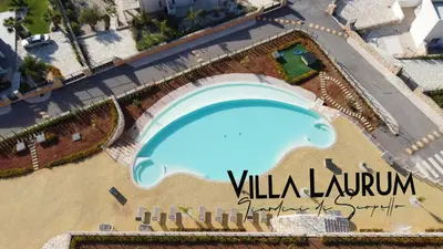 an overhead view of a swimming pool at a resort at Villa Laurum - Giardino degli allori - Castellammare del Golfo - Scopello in Castellammare del Golfo