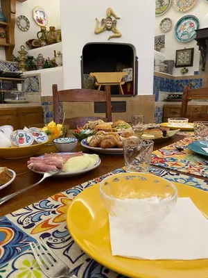 a table with plates of food on top of it at Azulè in San Vito lo Capo