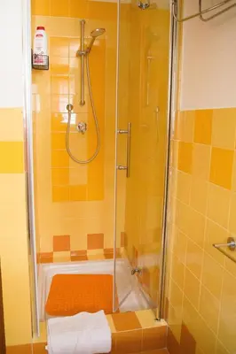 a bathroom with a shower and a bath tub at Mau House 44 Apartment in Palermo