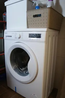 a white washing machine with a basket on top of it at CATHEDRAL APARTMENT in Palermo