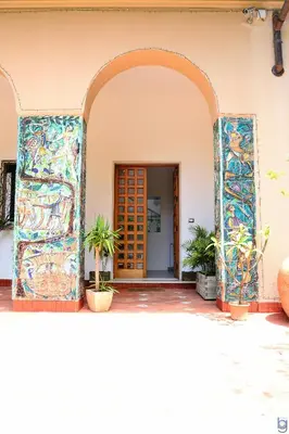 an entrance to a building with a colorful mosaic doorway at B&b Mondello Resort in Palermo