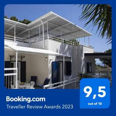 a view of a house with the travel review awards logo at Villa Aurora Mondello Addaura in Mondello
