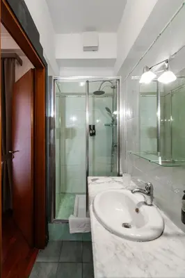 a bathroom with a sink and a shower at Hotel City Center in Palermo