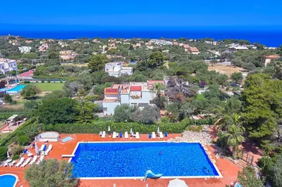 an aerial view of a resort with a swimming pool at Casa del Melograno con idromassaggio e giardino in Terrasini