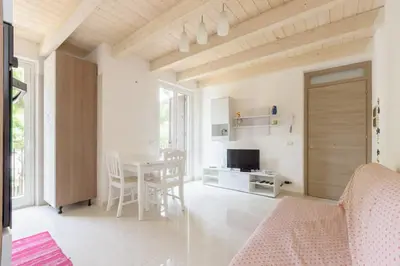 a living room with a table and a dining room at Duchessa in Castellammare del Golfo