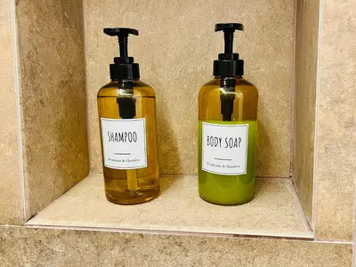 two bottles of soap sitting on a shelf at Gagini House & Terrace in Palermo