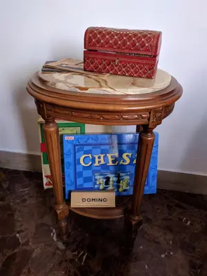 a small table with a box on top of it at Olivarooms in Palermo