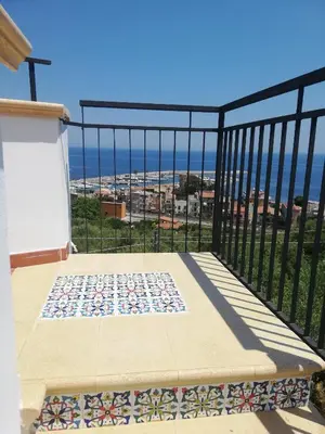 a balcony with a view of the ocean at Benvenuti al Sud in Trabia