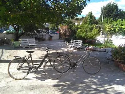 two bikes parked next to each other on a sidewalk at casa nina in Mondello