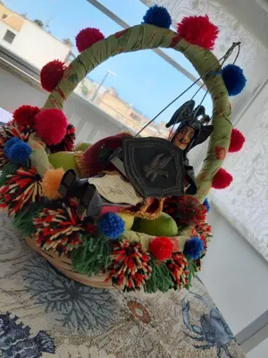a wicker basket with a woman on it at Finestra Azzurra in San Vito lo Capo