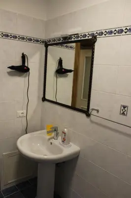 a bathroom with a sink and a mirror at cocciu d'amuri in Caccamo