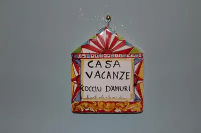 a hanging ornament with a csa variancerocatownatown sign at cocciu d'amuri in Caccamo