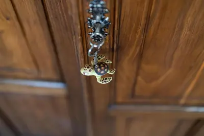 a close up of a door knob on a wooden door at Villa Uluvud with Pool Gym Sauna in Alcamo