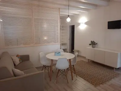 a living room with a table and a couch at Casa di Magda in Castellammare del Golfo