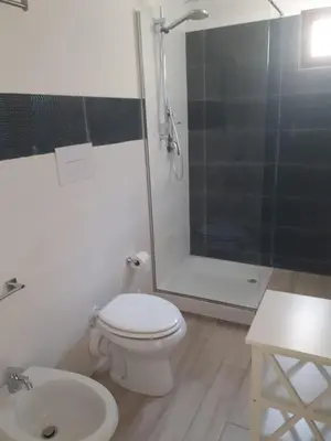 a bathroom with a shower and a toilet and a sink at Casa di Magda in Castellammare del Golfo