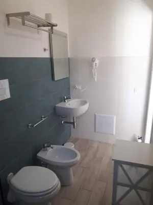a bathroom with a toilet and a sink at Casa di Magda in Castellammare del Golfo