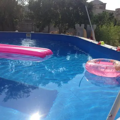 a pool with two inflatable tubes in the water at White Home. Casa Relax, piscina, free wi-fi & posto auto. in Palermo