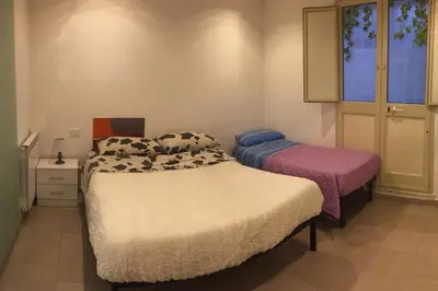 a kitchen with a purple light in a room at White Home. Casa Relax, piscina, free wi-fi & posto auto. in Palermo