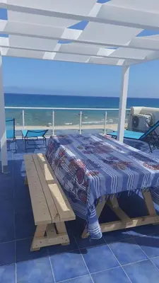 a bed on a cruise ship with the ocean in the background at Alcamo Marina Residence in Alcamo Marina