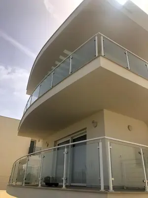 a balcony of a house with glass doors at Alcamo Marina Residence in Alcamo Marina