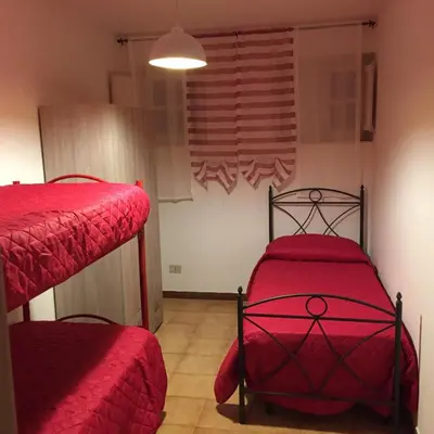 a bedroom with two bunk beds and a window at George House Mondello 34 in Mondello