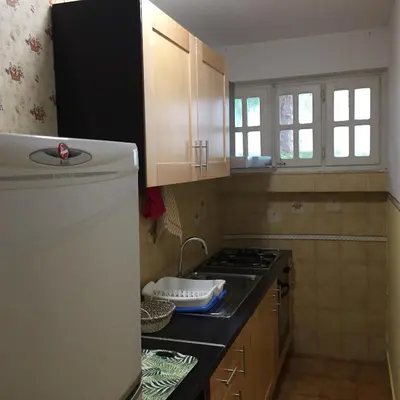 a kitchen with a stove and a counter top at George House Mondello 34 in Mondello