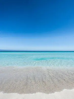 a sandy beach with the ocean in the background at Casetta Vista Mare in Piazza a Mondello by Wonderful Italy in Palermo