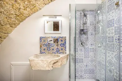 a bathroom with a sink and a shower at Stylish Home in Front of Casa Professa by Wonderful Italy in Palermo