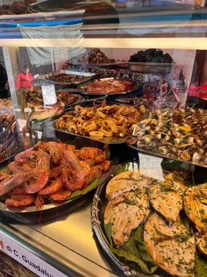 a buffet filled with lots of different types of food at Apartment Rua Formaggi in Palermo
