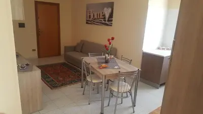 a living room with a table and a couch at Giusy's Place 1 in Campofelice di Roccella