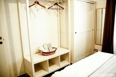 a bathroom with a mirror and a basket on a shelf at Villa Lindi in Castellammare del Golfo