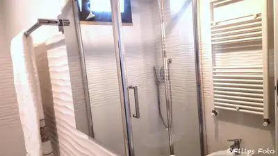 a bathroom with a shower with a toilet and a sink at Villa Lindi in Castellammare del Golfo