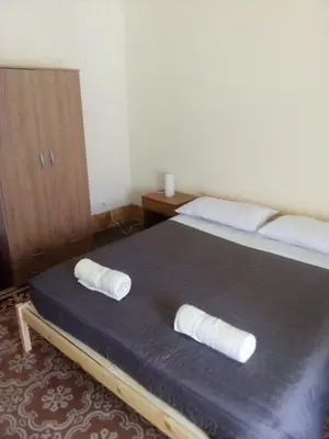 a bedroom with a bed with two pillows on it at Arco di ballarò in Palermo