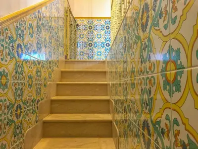 a staircase in a room with colorful tiles at VILLA VENERE con vista sul mare in San Vito lo Capo