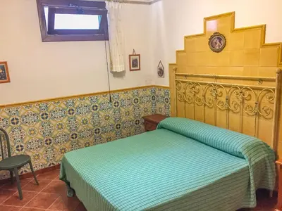 a bedroom with a bed in a room at VILLA VENERE con vista sul mare in San Vito lo Capo