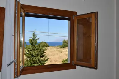 a window with a view of the ocean at Baglio La Riserva in Scopello