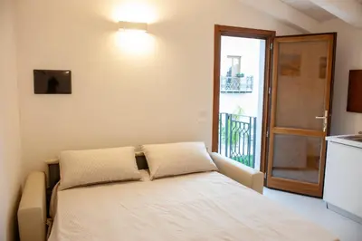 a bed with two pillows in a room with a window at Baglio La Riserva in Scopello
