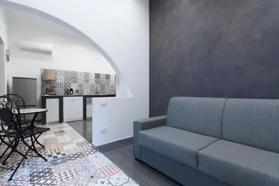 a living room with a couch and a table at Casa Leonardo e Romeo in Castellammare del Golfo
