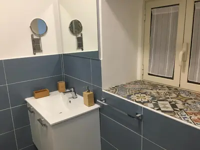 a bathroom with a sink and a shower at Casa Nicuzza in Palermo