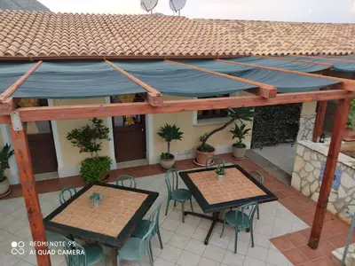 an overhead view of a patio with tables and chairs at Casa Fico D'India in San Vito lo Capo