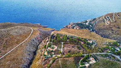 an aerial view of a mountain with the ocean at Baglio Cracchiolo da Tuzzo - Casa Carrubbo in San Vito lo Capo