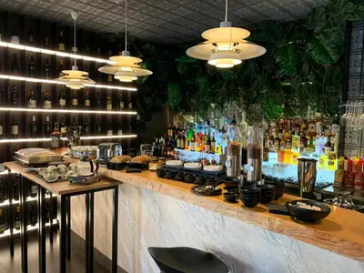 a bar with a lot of bottles of alcohol at Hotel Pontemare in Palermo