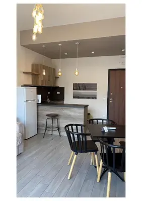 a kitchen and dining room with a table and chairs at Hotel Pontemare in Palermo