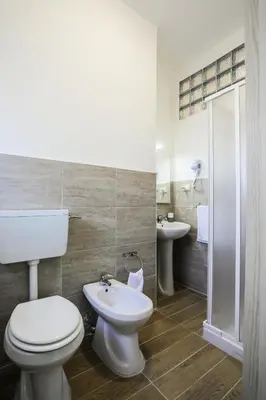 a bathroom with a toilet and a sink at A Casa di Fra' in Palermo