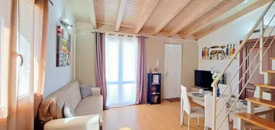 a living room with a couch and a desk and a television at Villa MiraMar Luxury Suite Palermo Airport in Carini