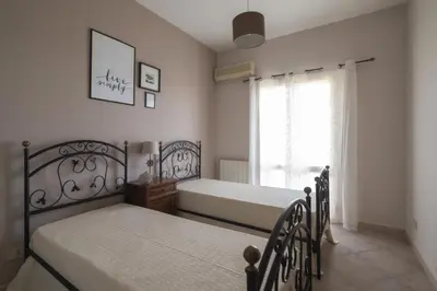 a bedroom with two beds and a window at SICULI HORTIS SEA HOME - Villa - Jacuzzi - Air Conditioning - Free Parking - Video Surveillance & Alarm System in Altavilla Milicia