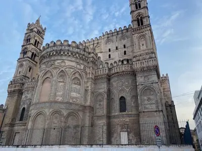 a large building with a clock tower on it at IL PANARO in Palermo
