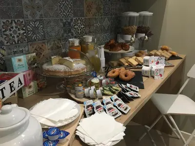 a table topped with lots of different types of food at Le Stanze Dell'Emiro in Palermo