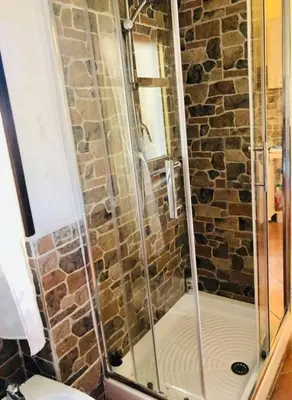 a shower with a glass door in a bathroom at Teatro Massimo Apartment- SELF CHECK-IN in Palermo
